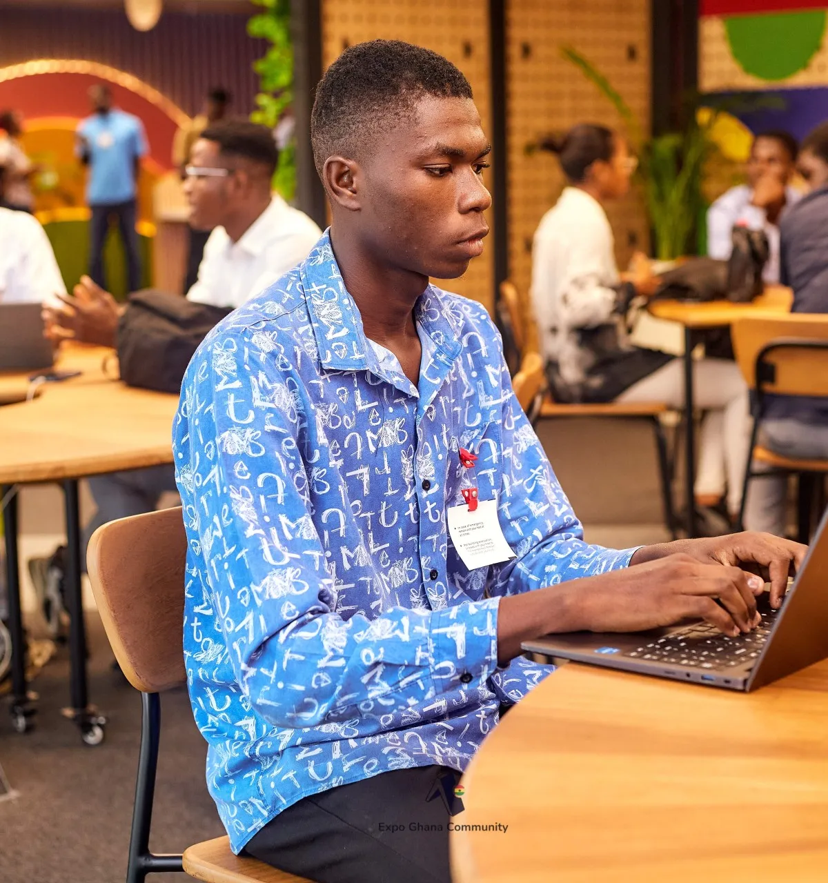 Kelvin N.O. Lamptey working at a computer